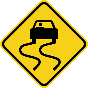 car skidding on a road sign