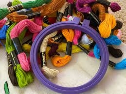 Embroidery supplies (hoop and colorful thread)